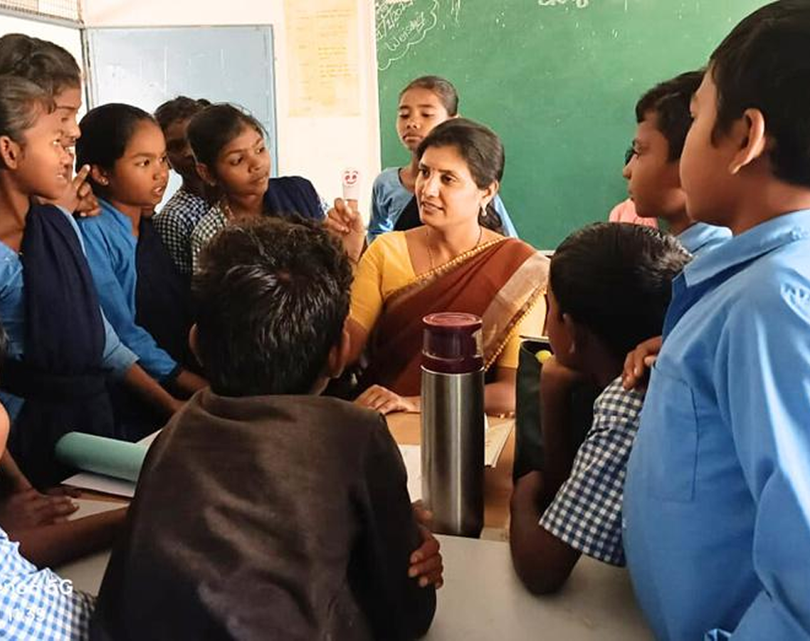 Teacher leading a classroom discussion in Maharashtra